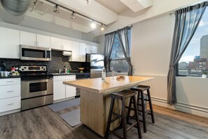 Fridge, microwave, oven, stovetop - Chic 2-bedroom Urban Loft Condo Near Rogers Place Ice District Downtown Edmonton (Edmonton)