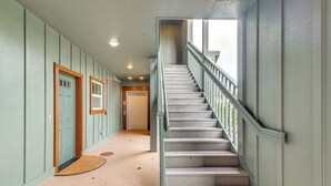 A staircase with a metal railing leading to an upper floor. - Riverfront Apt in Old Town Florence! (Florence)