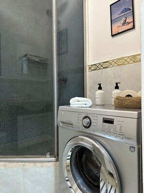 Shower, hair dryer, towels, soap