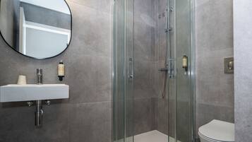 Shower, rainfall showerhead, towels, soap
