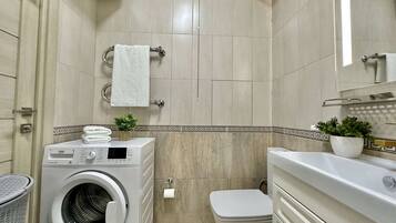 Hair dryer, towels, soap, toilet paper