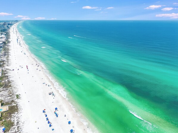 On the beach, sun-loungers - Salty Kisses 🏝 Ocean Front Condo Heated Pool, Hot Tub, Fitness and Game Room!! (Panama City beach)