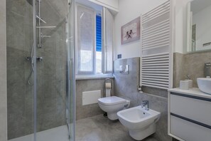 Hair dryer, towels, soap, toilet paper