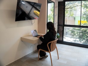 Deluxe Apartment, City View | Living area | 32-inch plasma TV with cable channels