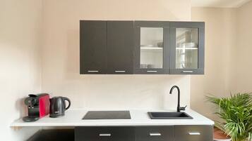 Fridge, stovetop, coffee/tea maker, cookware/dishes/utensils