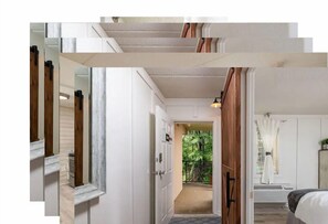 Comfortable rooms feature a bed, nightstand, and window with white curtains.
