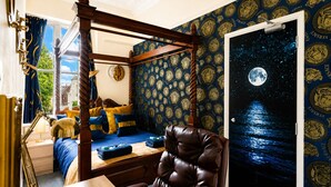 A bedroom with a four-poster bed, a night sky mural, and a view of a building through a window. - STR8BS8 Banksy 2-Bedroom Apartment, Clifton, Parking & Garden (Redland)