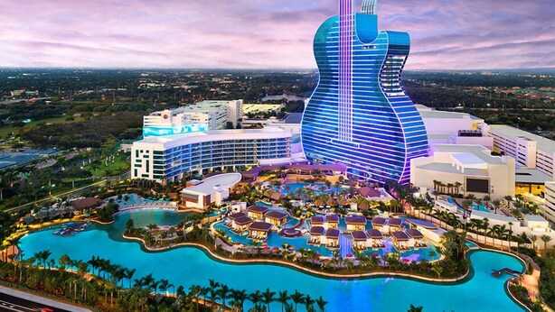 A resort with a large pool area, a distinctive guitar-shaped building, and multiple hotel structures. - Beautiful Oasis in Fort Lauderdale (Davie)