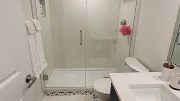 Shower, hair dryer, towels, soap