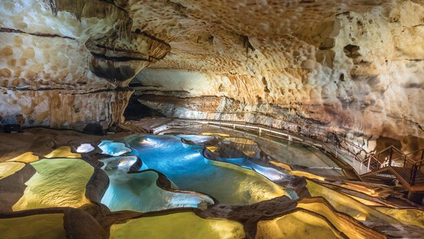 A cave interior with stalactites, stalagmites, and a reflective water pool. - Pet friendly home in Cornillon (Cornillon)