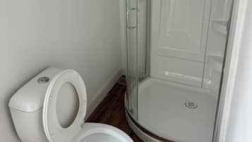 Shower, towels, soap, toilet paper