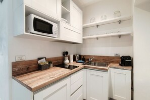 Fridge, microwave, coffee/tea maker, toaster