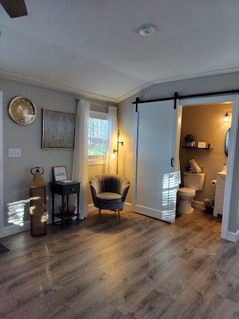 Hair dryer, towels, soap, toilet paper. Charming Cozy Cottage Pittsboro