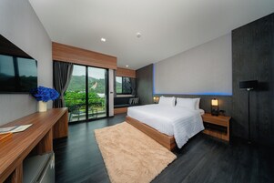 Deluxe tweepersoonskamer, 1 kingsize bed | Luxe beddengoed, een gratis minibar, een kluis op de kamer