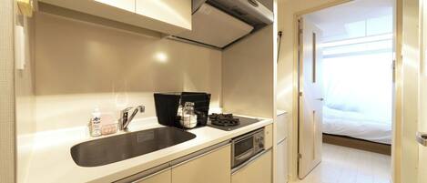 Fridge, microwave, stovetop, cookware/dishes/utensils