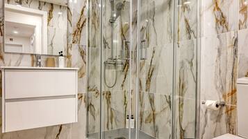 Shower, hair dryer, towels, soap