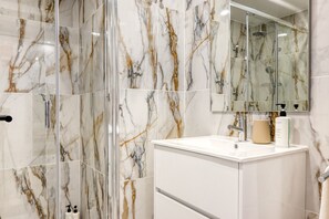 Shower, hair dryer, towels, soap