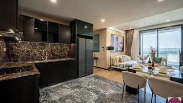 Premium Apartment, 1 Bedroom, Patio, City View | 1 bedroom, memory foam beds, minibar, in-room safe
