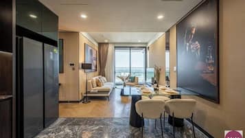 Premium Apartment, 1 Bedroom, Patio, City View | Living area | Foosball, books, music library