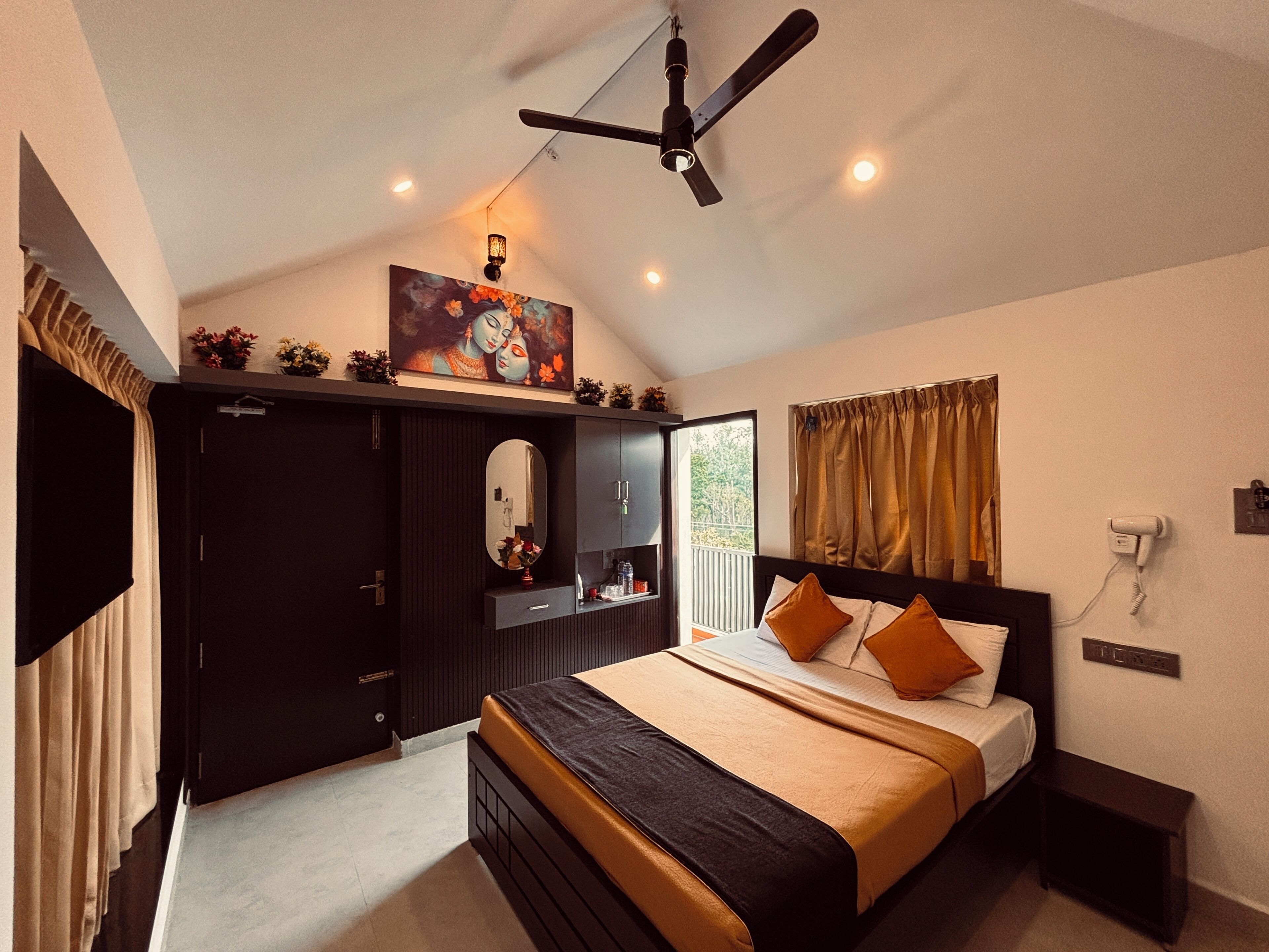 A bedroom with a bed, a ceiling fan, a nightstand, a mirror, a dresser, and a window with curtains.