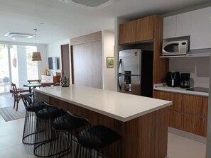 Fridge, microwave, stovetop, coffee/tea maker