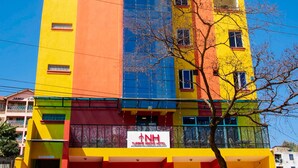 A multi-story building with a prominent NH Turbine Inn Hotel sign. - Turbine Ngong Hotel (Ngong)