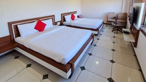 A hotel room with two beds, a ceiling fan, and a TV. - HOTEL SHIV SHAKTI (Goharganj)