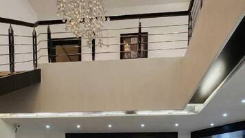 Deluxe Single Room, Garden View | Living area | TV