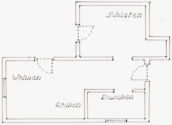 A floor plan with labeled rooms: Wohnen, Küche, Schlafen, and Duschen.