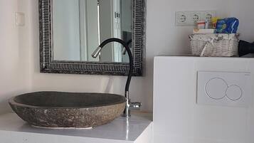 Shower, hair dryer, towels, toilet paper