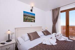 Enjoy a restful stay in this stylish room with a comfortable bed, bedside table, and scenic view.
