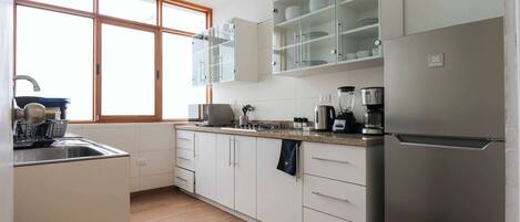 Fridge, microwave, stovetop, coffee/tea maker