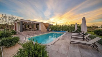 Outdoor pool, a heated pool, pool umbrellas, sun loungers