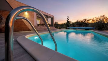 Outdoor pool, a heated pool, open open 24 hours, sun loungers