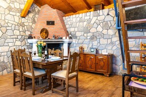 Villa | Living room | TV, fireplace