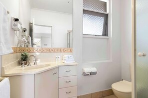 Shower, hair dryer, towels