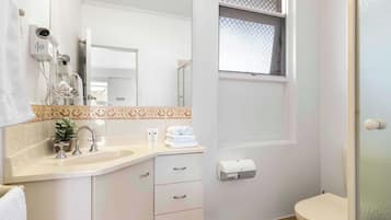 Shower, hair dryer, towels, soap