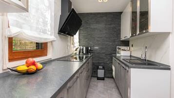 Apartment (A1) | Private kitchen | Oven, electric kettle
