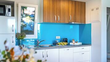 Villa | Private kitchen | Oven, electric kettle, toaster