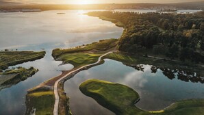 A golf course with water hazards and a path. - Sölvesborgs Golfklubb (Sölvesborg)
