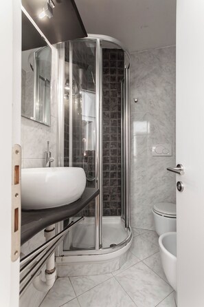 Shower, eco-friendly toiletries, hair dryer, bidet