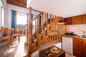 Apartment Split Level with Garden or Pool | Private kitchenette | Mini-fridge, stovetop, coffee/tea maker, electric kettle