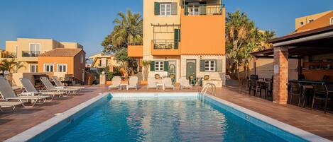 Outdoor pool, pool umbrellas, pool loungers