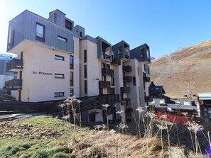 A modern multi-story building with balconies, labeled "Le Pramecou." - Bright Studio Near Slopes and Shops with Balcony (Tignes)