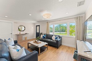 TV, offices - Canal Front Paradise | 4BR w Private Dock! (Cocoa Beach)