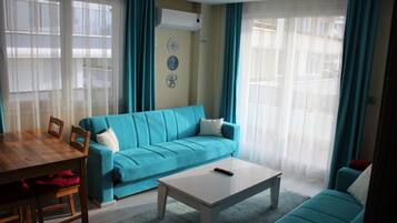 Economy Apartment, Balcony, Garden View | Living room | 82-inch LCD TV with satellite channels, toys