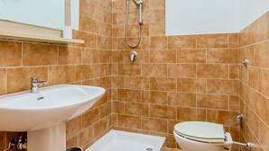 A bathroom with a sink, toilet, bidet, and shower. - countryside  3 - One Bedroom Guest House, Sleeps 2 (Carbonia)