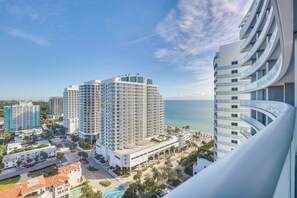 A high-rise hotel with multiple balconies overlooking a beach and ocean. - Walk to Beach & Dining! Luxe Fort Lauderdale Condo (Fort Lauderdale)