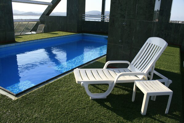Outdoor pool, open 10:00 AM to 9:00 PM, pool loungers