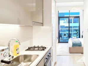 Iron/ironing board, bed sheets - Riviera Studio Stay With Balcony Views (Dubai)